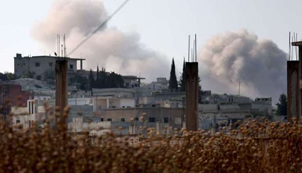 Smoke billows in the village of Hamameya in Syria's Idlib province. AFP