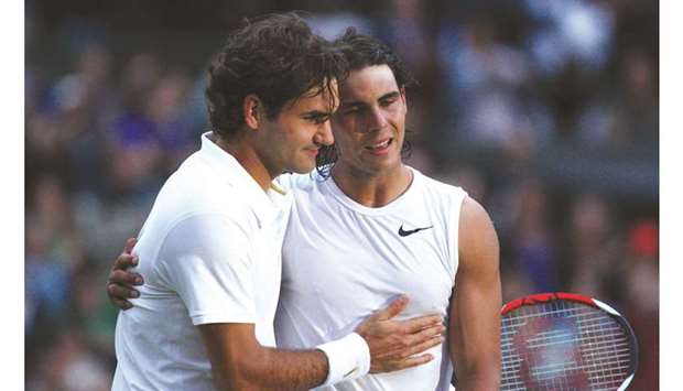 In this July 6, 2008, picture, Rafael Nadal (right) is congratulated by Switzerlandu2019s Roger Federer after the Spaniard won their Wimbledon final at The All England Club in London. (AFP)