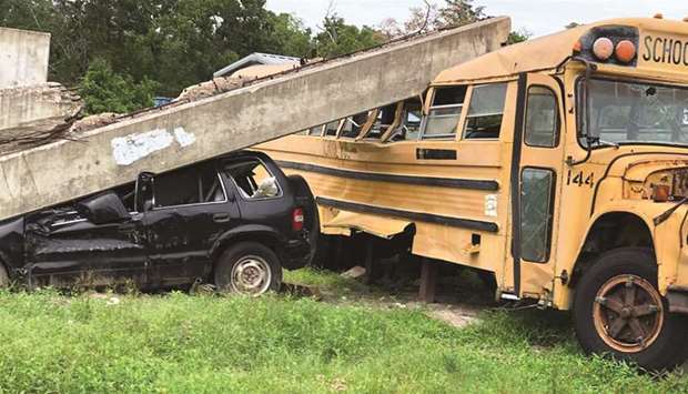 DISASTER: A concrete beam sits atop a school bus in Disaster City, College Station, Texas. The more than 1,200 tornadoes recorded as of June 23 arenu2019t the most ever (there were 1,817 in 2004), but this yearu2019s total has easily surpassed the average range of 979 for a season.