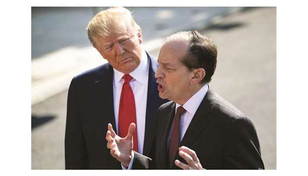 US President Donald Trump listens to labour secretary Alexander Acosta during a media address yesterday at the White House in Washington, DC.