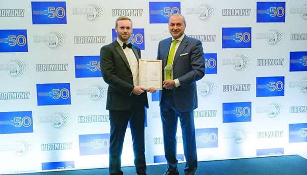 QIB Group CEO Bassel Gamal (right) receiving the award during the 2019 Euromoneyu2019s Awards for Excellence ceremony held recently at the London Hilton on Park Lane.