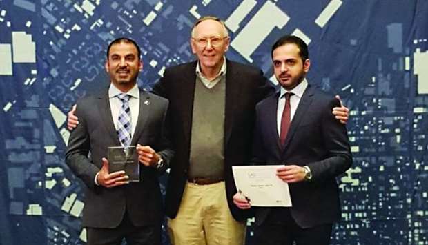 Aref Hassan Ibrahim, Director of Technical Affairs at the National Command Centre, and Captain Hassan Ali al-Malki, head of GIS, with Jack Dangermond, CEO of ESRI, US.