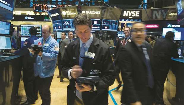 Traders work on the floor of the New York Stock Exchange (file).