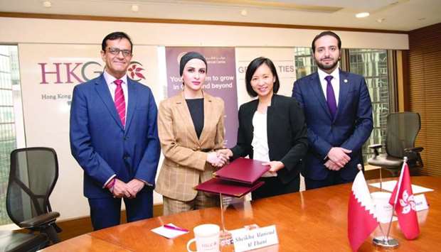 Sheikha Alanoud bint Hamad al-Thani, managing director, Business Development at QFC, with officials during the MoU signing ceremony with HKGCC.