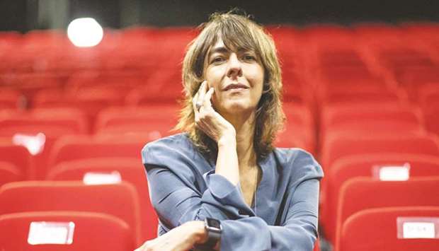 Brazilian stage director Christiane Jatahy poses during the 73rd International Theatre Festival in Avignon, southeastern France, on Friday. In her play The Lingering Now, the director tells the story of modern exile from Syria to the Amazon rainforest by echoing the adventures and emotions experienced by Homeru2019s Ulysses.