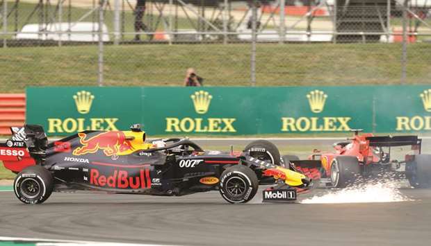 Red Bullu2019s Max Verstappen and Ferrariu2019s Sebastian Vettel collide during the British GP. (Reuters)