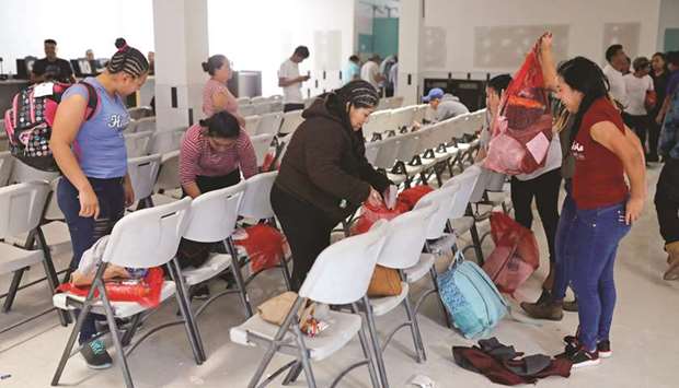 Guatemalan migrants gather their belongings at a reception centre for returnees, upon their arrival from the US, in Guatemala City, Guatemala.