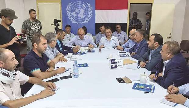 A handout picture provided yesterday by the UN of Lt Gen Michael Lollesgaard and members of the UN Redeployment Co-ordination Committee on Hodeidah meeting on a ship at sea off the coast of the Yemeni port city, including representatives of the UN, the Yemeni government, and the Houthi rebels.