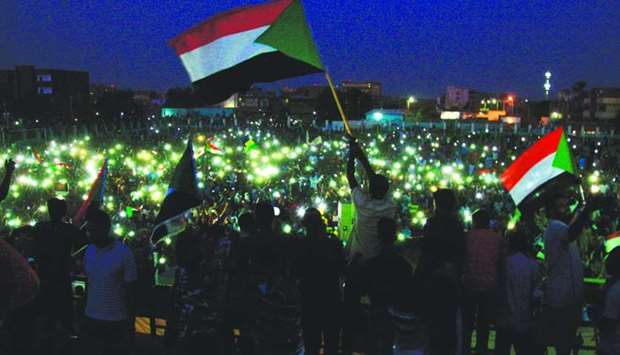 Sudanese protesters take part in a vigil in the capital Khartoum's northern district of Bahri, to mourn dozens of demonstrators killed last month in a brutal raid on a Khartoum sit-in, on July 13.