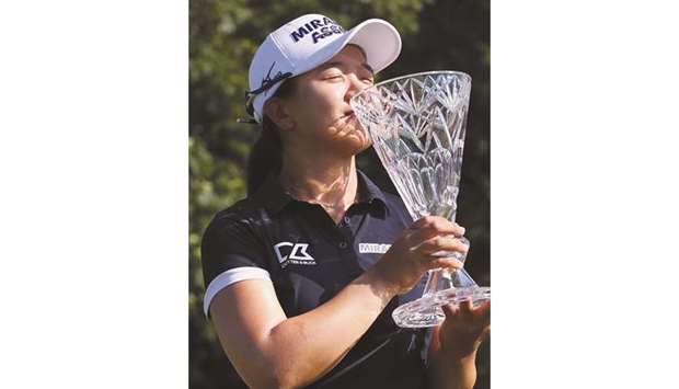 Kim Sei-young of South Korea kisses her trophy after winning the Marathon Classic. (AFP)