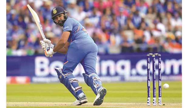 Indiau2019s Rohit Sharma became first player to hit five centuries in a single World Cup and was the leading scorer in the tournament with 648 runs. (AFP)