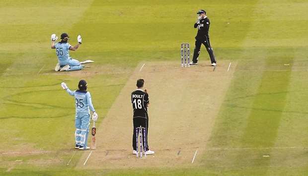 Englandu2019s Ben Stokes (left) apologises after an attempted run out hits his bat and the ball goes for four during the ICC Cricket World Cup final against New Zealand at Lordu2019s in London on Sunday. (Reuters)
