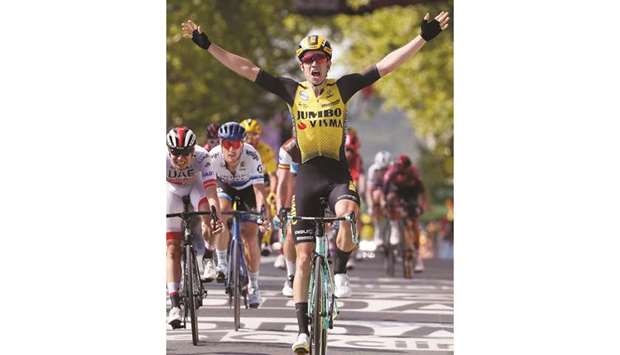 Team Jumbo-Visma rider Wout Van Aert of Belgium celebrates after crossing the finish line to win stage 10 of the Tour de France yesterday.