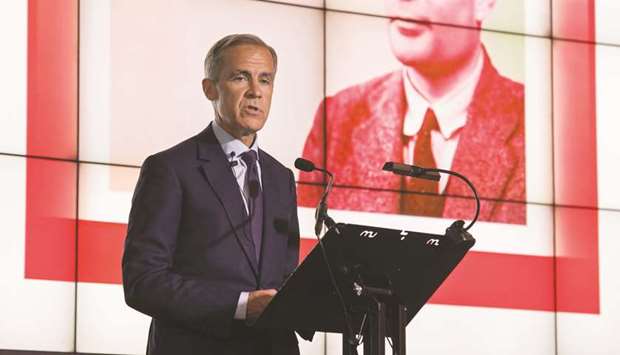 Mark Carney, governor of the Bank of England, speaks in front of the concept design for the new Bank of England u00a350 banknote, featuring mathematician and scientist Alan Turing, during the presentation at the Science and Industry Museum in Manchester, north-west England yesterday.