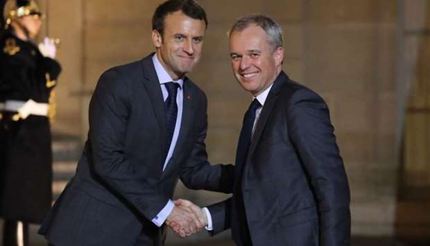In this file photo taken on November 20, 2017 French president Emmanuel Macron (L) welcomes then National Assembly President Francois de Rugy for a meeting at the Elysee Palace in Paris