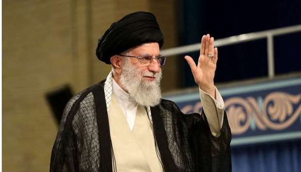 Iran's Supreme Leader Ayatollah Ali Khamenei waves during ceremony attended by Iranian clerics in Tehran