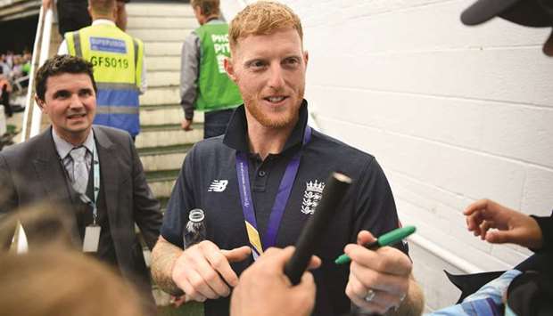 Englandu2019s Ben Stokes signs autographs during a World Cup victory event at The Oval in London on Monday. (AFP)