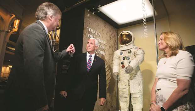 A Lunar Module, the same type that landed on the Moon for Apollo 11, is displayed behind Rick Armstrong, the son of Neil Armstrong, Vice President Mike Pence, Smithsonianu2019s National Air and Space Museum Director Ellen Stofan, appearing for the unveiling of Neil Armstrongu2019s Apollo 11 spacesuit at the Smithsonianu2019s National Air and Space Museum on the National Mall in Washington, DC.