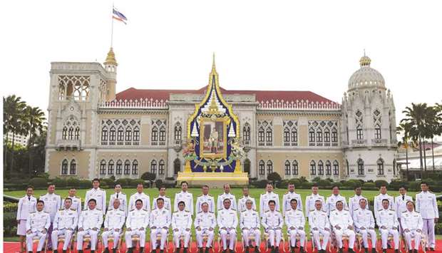 Thailandu2019s Prime Minister Prayut Chan-ocha (front centre) poses with members of the new Thai cabinet at Government House in Bangkok yesterday.