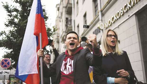 This picture taken on Sunday shows Yashin and Sobol at a rally against efforts to stop opposition candidates from registering for elections to the Moscow City Duma.