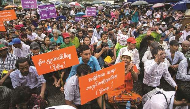 People participate in a demonstration to protest proposed amendments to the 2008 Myanmar Constitution in Yangon yesterday.