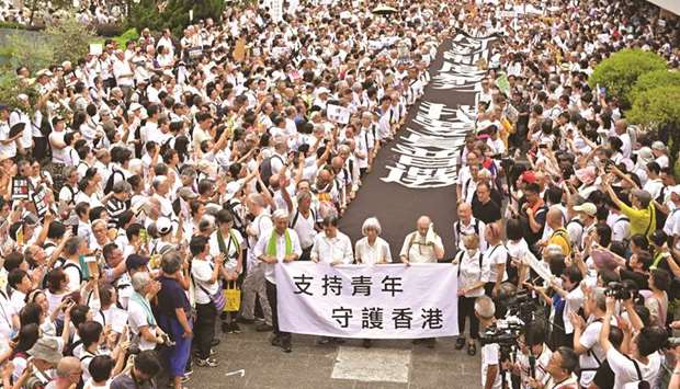 A group of elderly people march to the government headquarters in Hong Kong yesterday, in the latest protest against a controversial extradition bill.