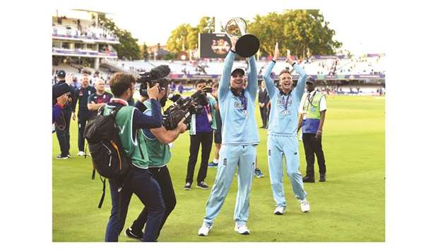 File photo of Engalandu2019s Jason Roy celebrating with the World Cup trophy at Lordu2019s Cricket Ground in London on July 14.