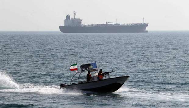 In this file photo taken on July 02, 2012 Iranian Revolutionary Guards drive speedboats in front of an oil tanker during a ceremony to commemorate the 24th anniversary of the downing of Iran Air flight 655 by the US navy, at the port of Bandar Abbas.