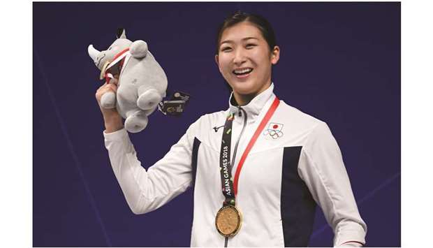 In this file photo taken on August 20, 2018 gold medallist Japanu2019s Rikako Ikee celebrates during the victory ceremony of the womenu2019s 100m freestyle swimming event during the 2018 Asian Games in Jakarta. (AFP)