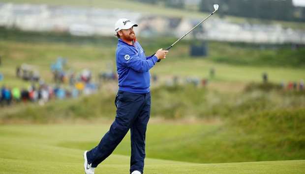 J. B. Holmes of the US watches his shot during the first round of the British Open at Royal  Portrush in Northern Ireland yesterday.