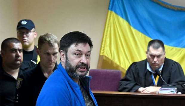 Ukrainian-Russian journalist Kyrylo Vyshynsky (C) speaks during a court hearing in Kiev on July