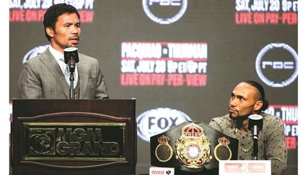 Philippine boxer Manny Pacquiao (left) speaks during a press conference as his opponent in todayu2019s bout, US boxer Keith Thurman, looks on in Las Vegas on Wednesday. (AFP)