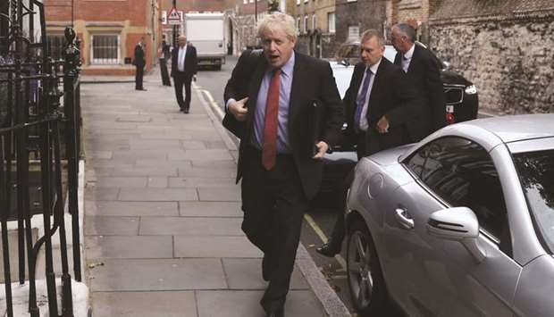 Boris Johnson, a leadership candidate for the Conservative Party, arrives at offices in central in London yesterday.
