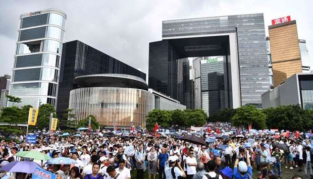 People attend a pro-government rally outside the government headquarters in Hong Kong. Tens of thousands of people -- many waving Chinese flags -- rallied in support of Hong Kong's police on July 20, a vivid illustration of the polarisation coursing through the city after weeks of anti-government protests.