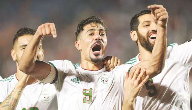 Baghdad Bounedjah and teammates celebrate winning the Africa Cup of Nations in Cairo yesterday.