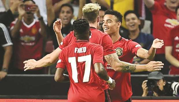 Manchester Unitedu2019s Mason Greenwood (right) is congratulated by teammates after scoring during the International Champions Cup match against Inter Milan in Singapore. (AFP)