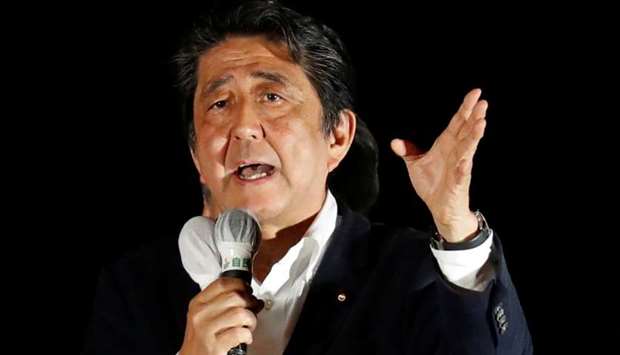 Japan's Prime Minister and Liberal Democratic Party's (LDP) leader Shinzo Abe speaks to voters on the last election campaign day ahead of Sunday's upper house election at Akihabara district in Tokyo yesterday.