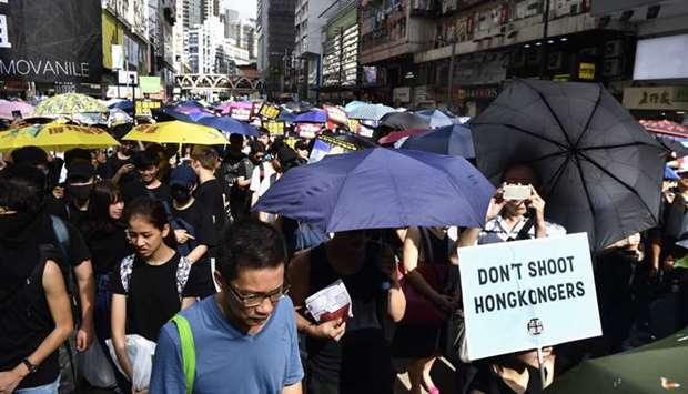 Protesters march against a controversial extradition bill in Hong Kong.