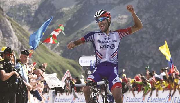 Franceu2019s Thibaut Pinot celebrates as he wins the fourteenth stage of the 106th edition of the Tour de France in Tourmalet Bareges yesterday. (AFP)