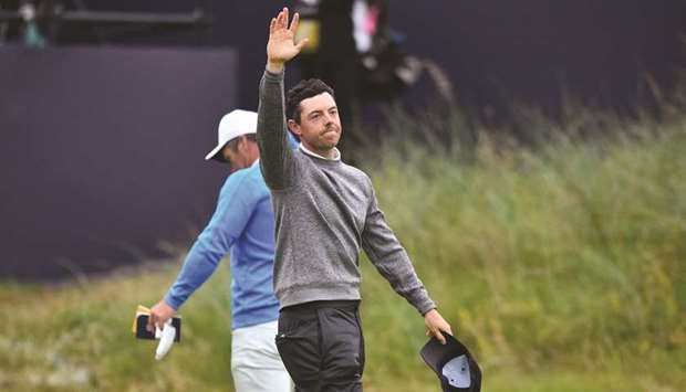 Northern Irelandu2019s Rory McIlroy waves as he leaves the 18th green after the second round of the British Open on Friday.