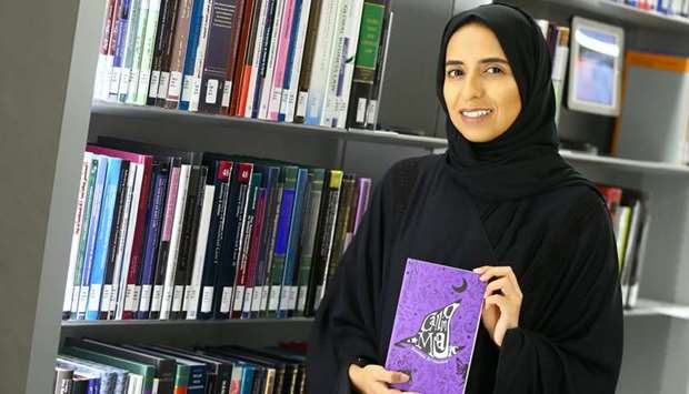 WEAVING MAGIC: Kummam al-Maadeed with her latest work Calling Magic.