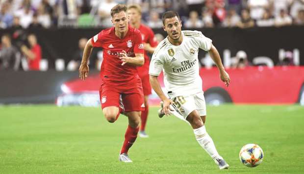 Real Madridu2019s Eden Hazard (right) controls the ball as Bayern Munichu2019s Joshua Kimmich chases during the first half of the International Champions Cup friendly match. (USA TODAY Sports)