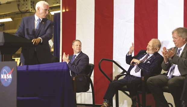 Astronaut Buzz Aldrin gives a thumbs up to Vice President Mike Pence during a ceremony to commemorate the 50th anniversary of the Apollo 11 moon landing, at Nasau2019s Kennedy Space Center in Florida on Saturday.