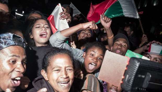 Fans of ,Barea,, Madagascar's national football team, celebrate in the streets of Antananarivo on June 30, 2019 after their team's 2-0 victory over Nigeria during their 2019 Africa Cup of Nations (CAN) Group B football match