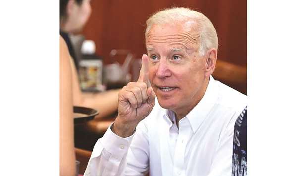Democratic party candidate Joe Biden gestures while meeting with patrons at Tamales Lilianas restaurant in Los Angeles, California, on July 19.