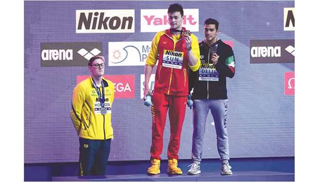 Silver medallist Mack Horton (left) of Australia refuses to stand on the menu2019s 400m freestyle podium with gold medallist Sun Yang (centre) of China at the 2019 FINA World Championships in Gwangju, South Korea, on Sunday. Italyu2019s Gabriele Detti (right) won bronze. (AFP)