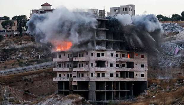 This picture shows the demolition of a Palestinian building which was under construction, in the Palestinian village of Sur Baher in East Jerusalem
