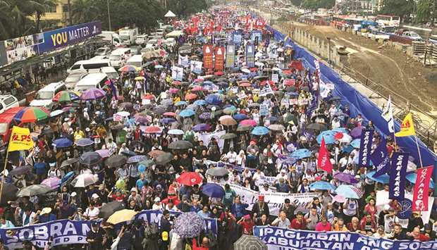 Thousands of activists march on the road leading to the Congress during a protest against Duterteu2019s annual State of the Nation Address in Manila yesterday.