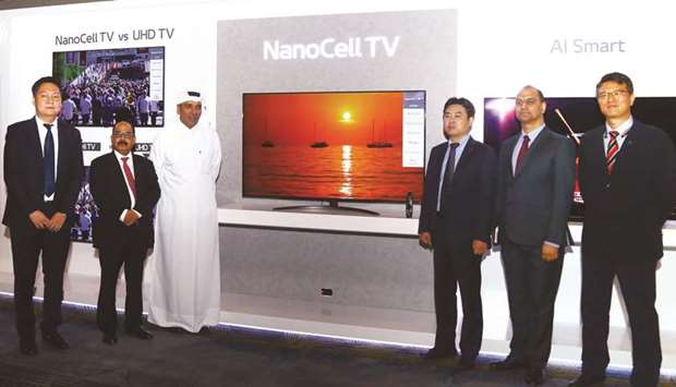 LG and Jumbo Electronics senior officials at the unveiling of new OLED and NanoCell televisions yesterday in Doha. PICTURES: Jayan Orma
