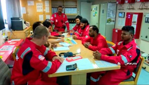 An image grab taken from a broadcast by Islamic Republic of Iran Broadcasting (IRIB) shows crew members of the British-flagged tanker Stena Impero, after it was seized by Iran's Revolutionary Guard Corps